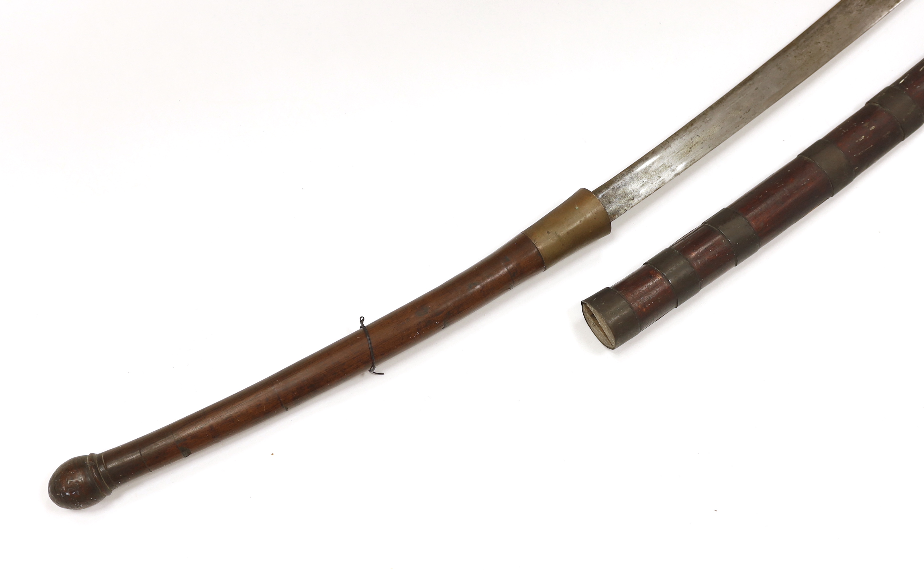 A large 19th century Burmese dha, in a wooden scabbard with metal bands, long wooden grip, blade 67.5cm